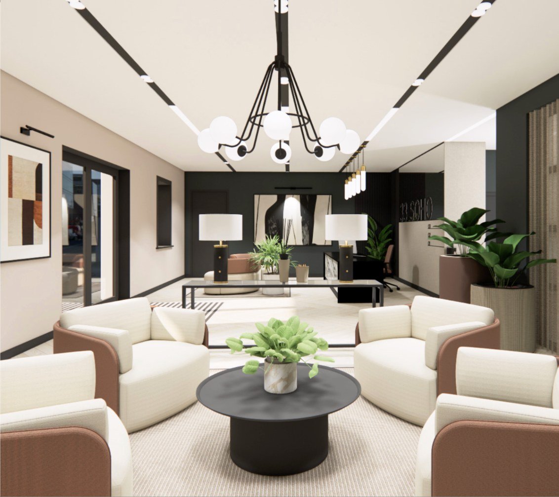 33 Soho reception lounge with curved contract armchairs, a round coffee table and statement pendant lighting